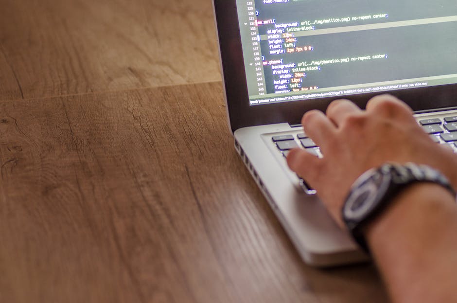 pexels-photo-574069-574069 Close-up of a person coding on a laptop, showcasing web development and programming concepts.